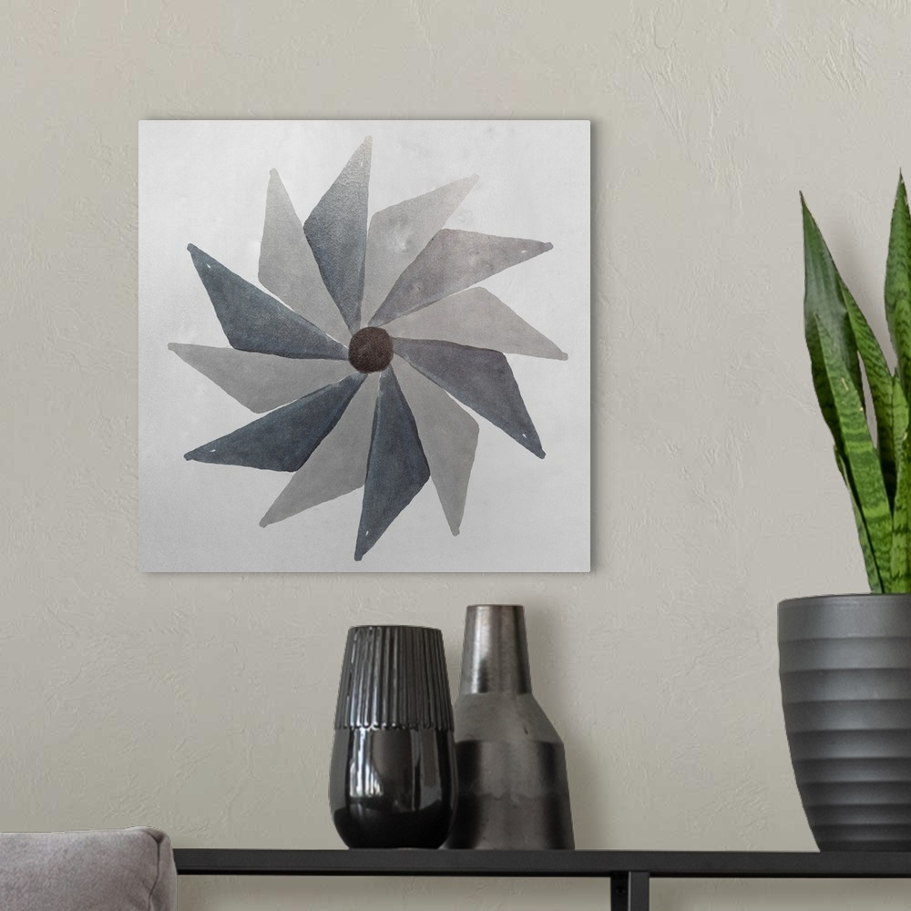 A modern room featuring Abstract pinwheel shape in shades of grey.