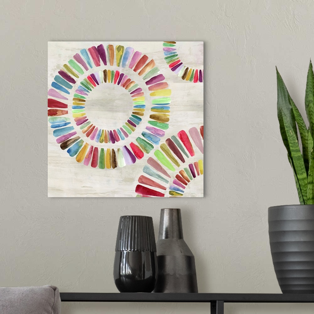 A modern room featuring Colorful rainbow paint strokes in rings.