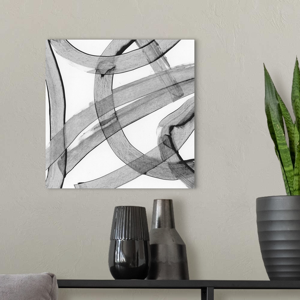 A modern room featuring Abstract art made of large, swirling grey strokes.