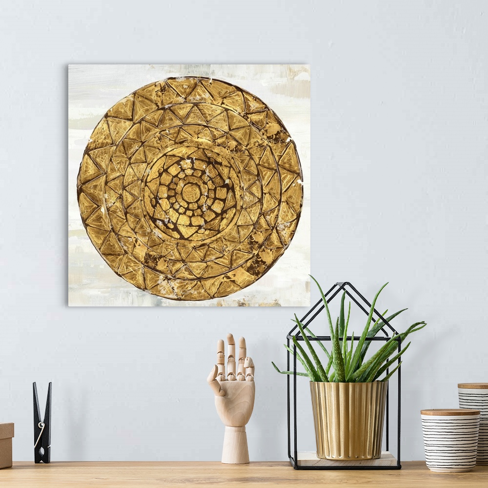 A bohemian room featuring Square image of a gold circle with textured triangle designs.