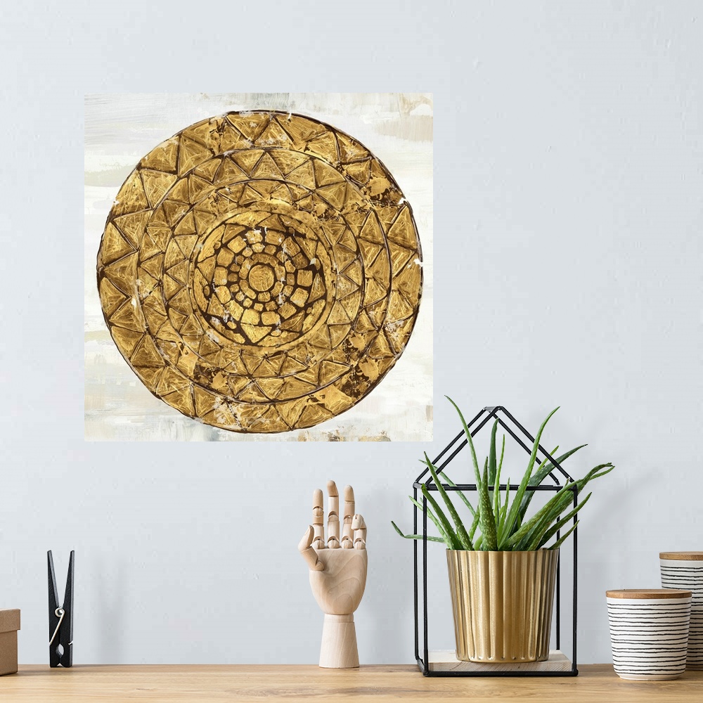 A bohemian room featuring Square image of a gold circle with textured triangle designs.