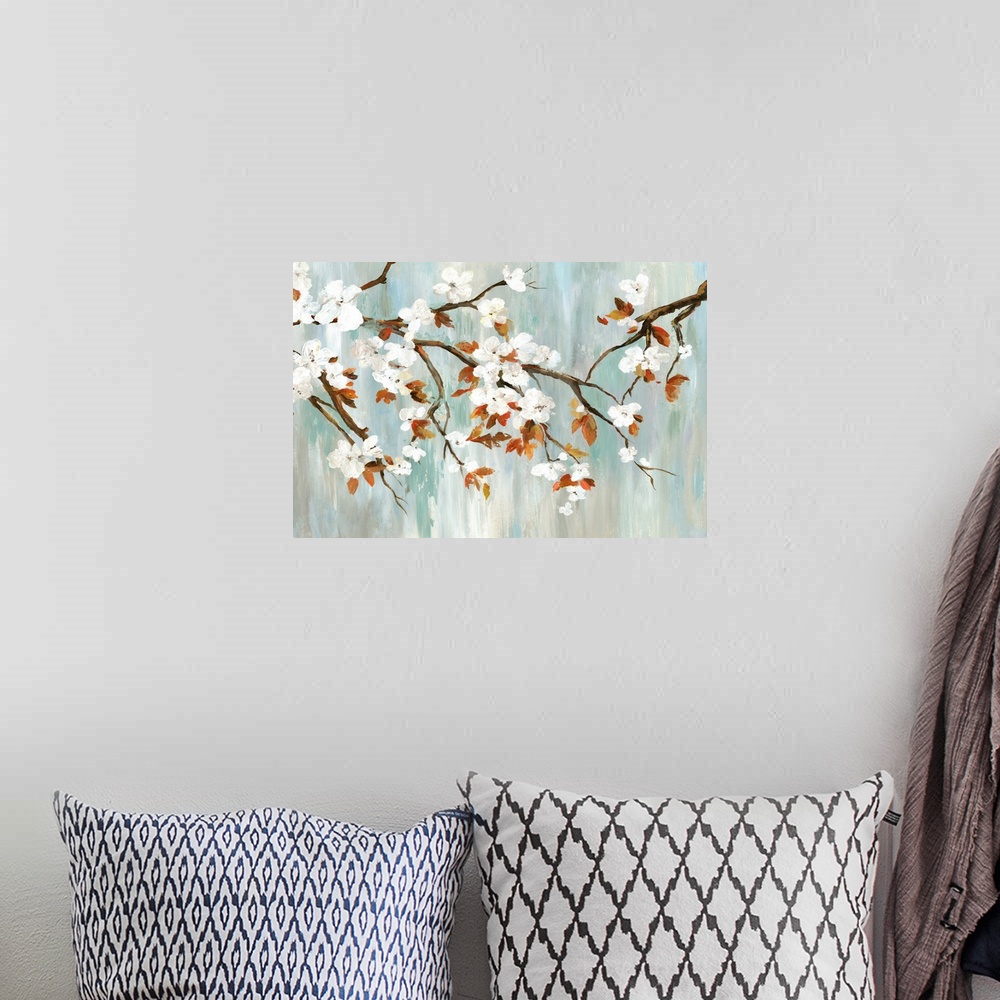 A bohemian room featuring A painting of a branch of white cherry blossoms against a gray and teal backdrop.
