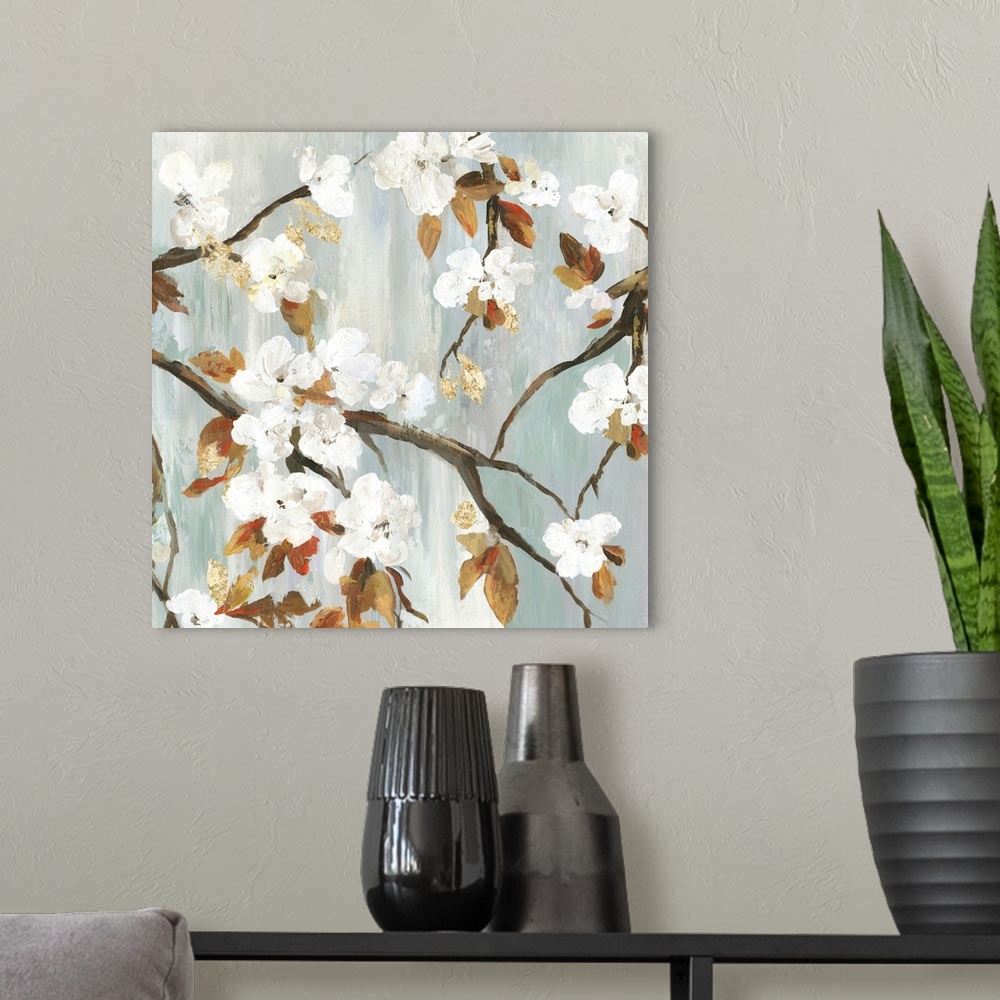 A modern room featuring A contemporary painting of white flower blooms on leaf covered branches against a neutral texture...