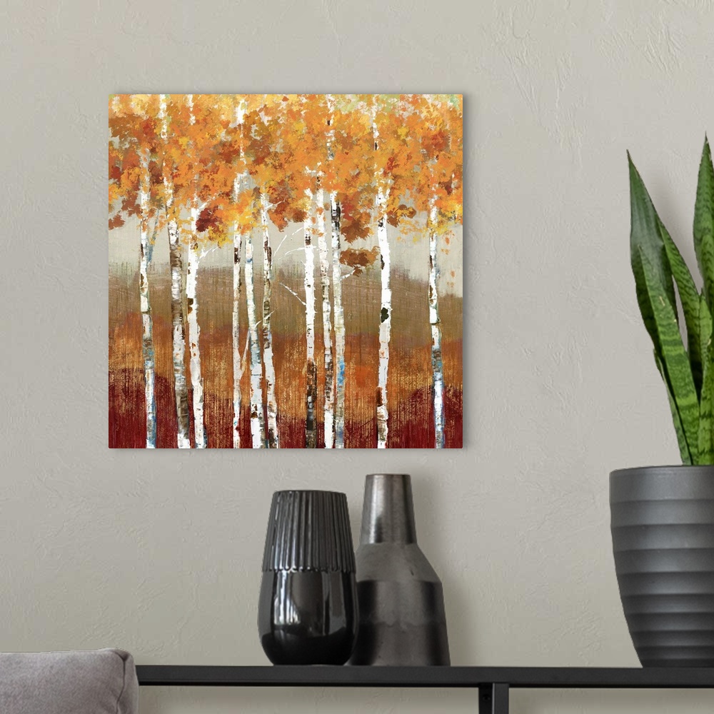A modern room featuring Painting of a group of birch trees with orange leaves in a forest.