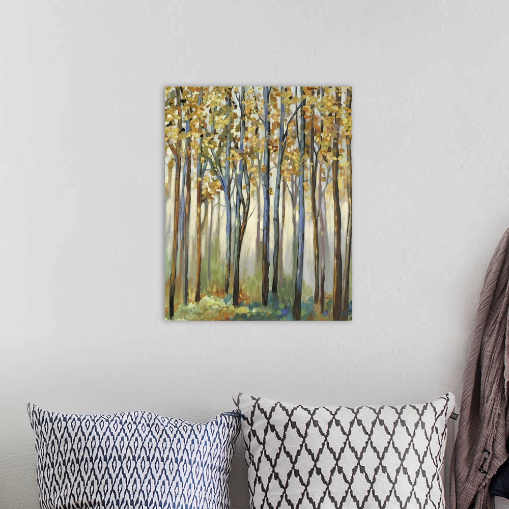 A bohemian room featuring A forest of tall, narrow trees with golden leaves.