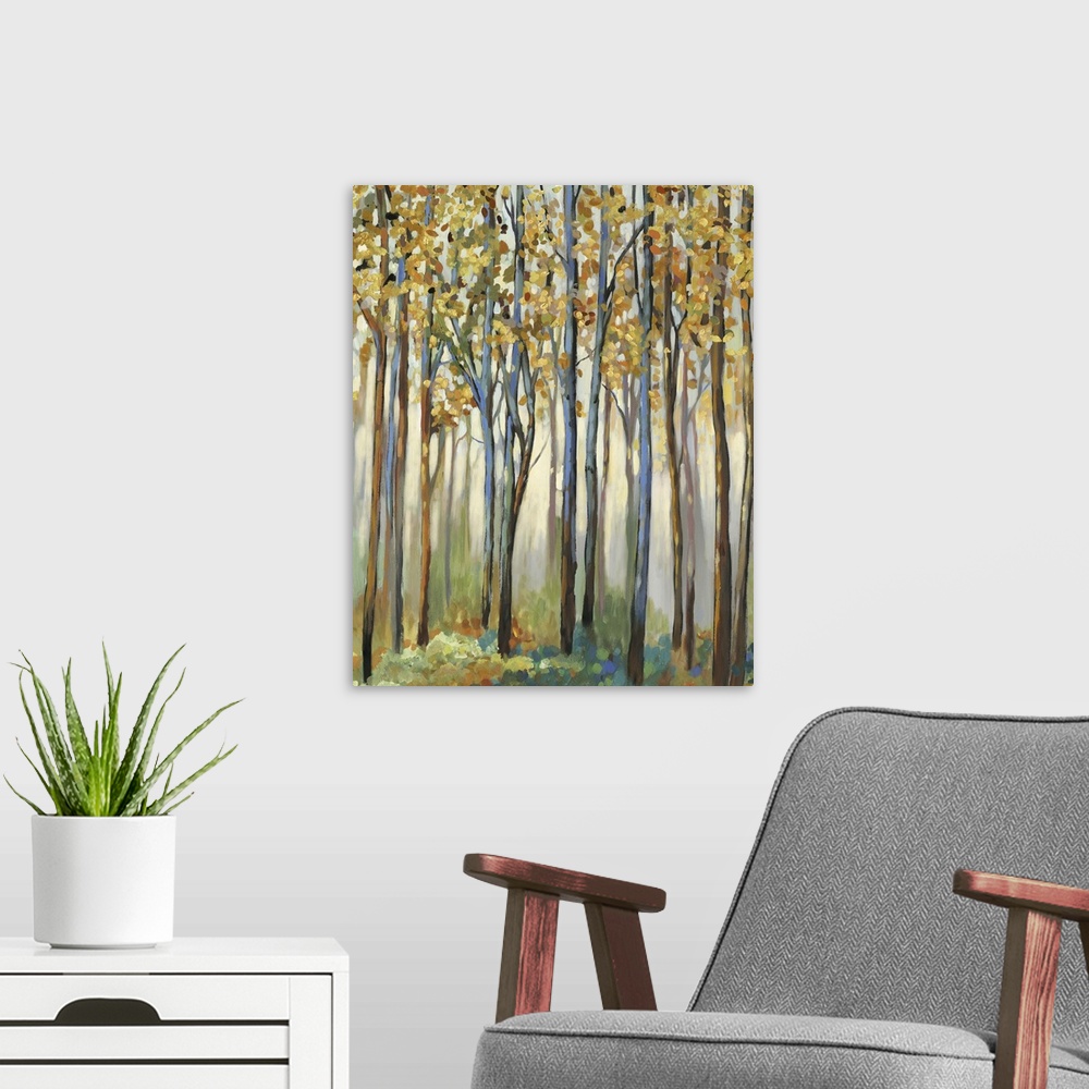 A modern room featuring A forest of tall, narrow trees with golden leaves.