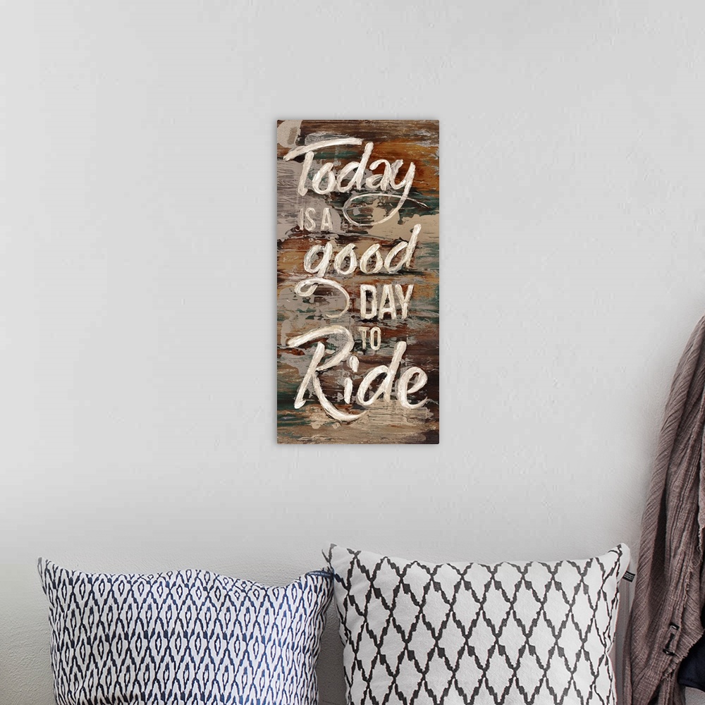 A bohemian room featuring "Today is a good day to ride" written in white lettering on a painted brown background.