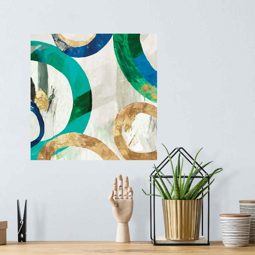 A bohemian room featuring Square abstract decor with rings in different sizes all around in blue, green, and gold hues on a...