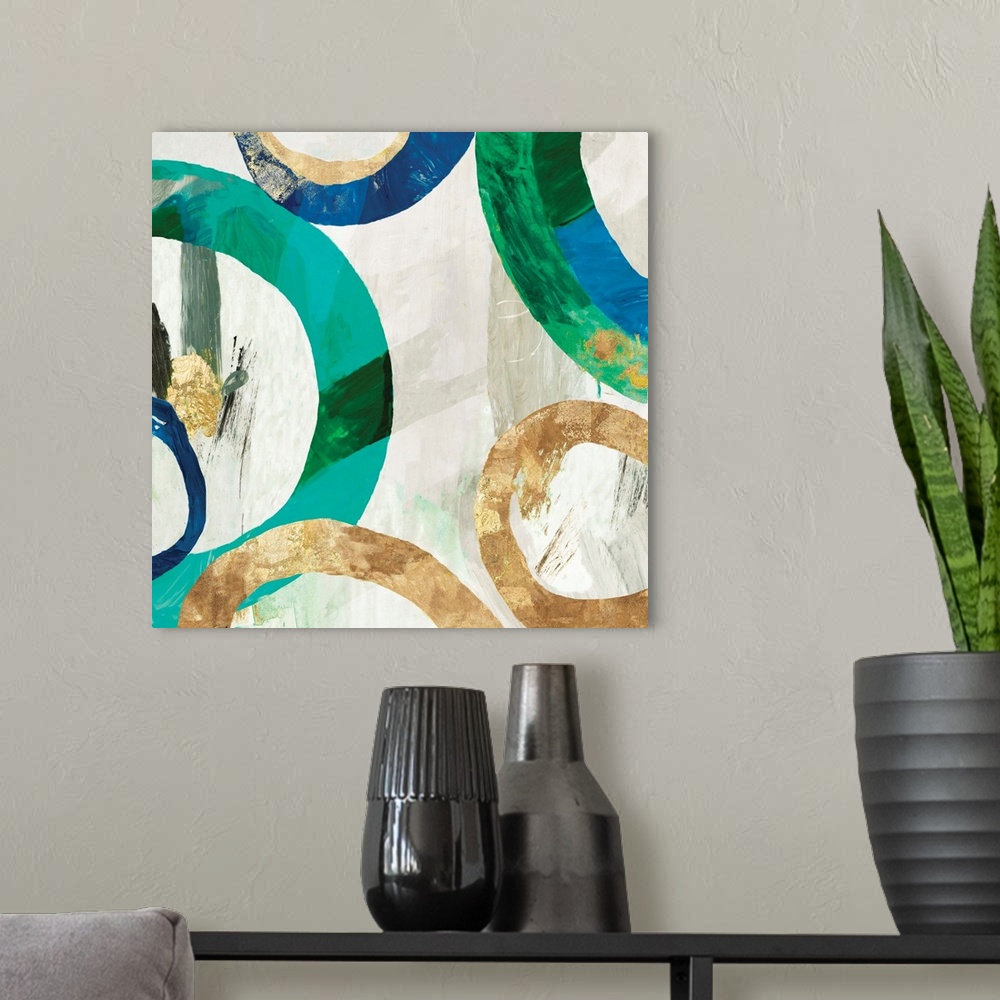 A modern room featuring Square abstract decor with rings in different sizes all around in blue, green, and gold hues on a...