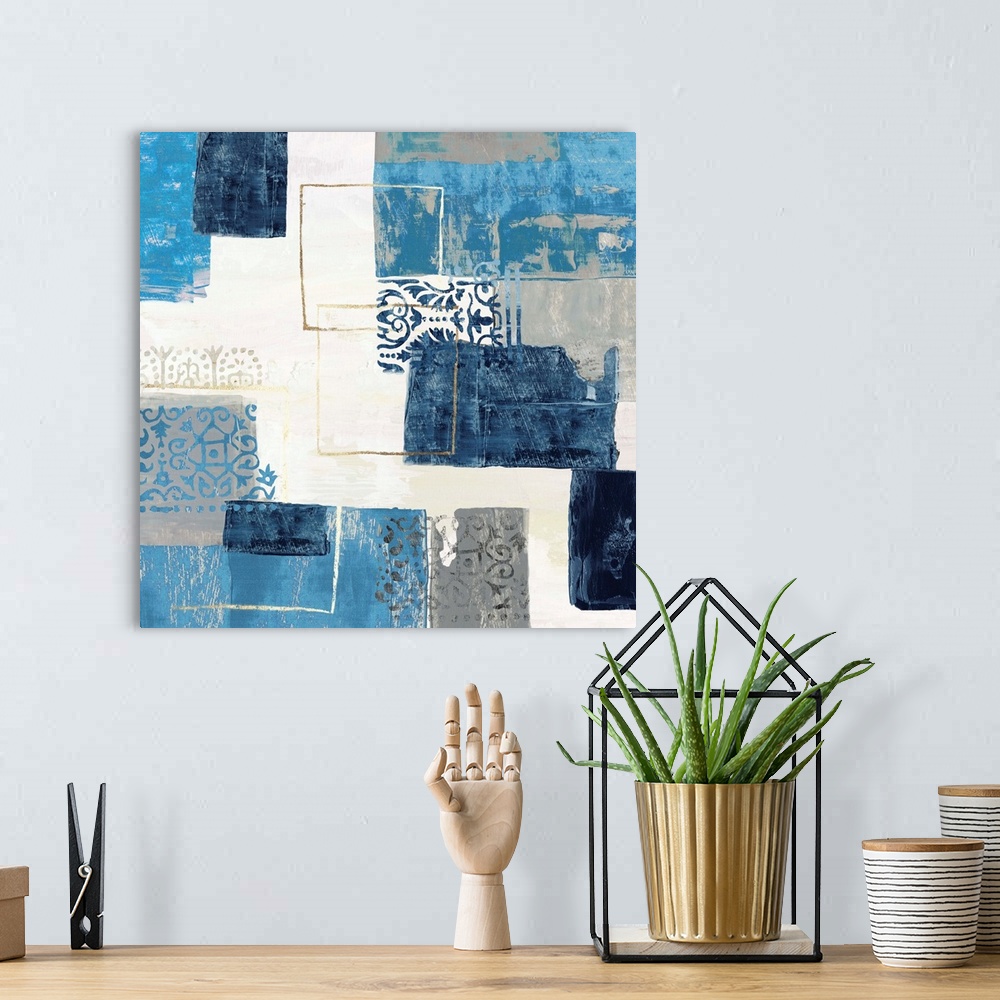 A bohemian room featuring Bohemian abstract painting in a variety of blue and gray tones with metallic accents.