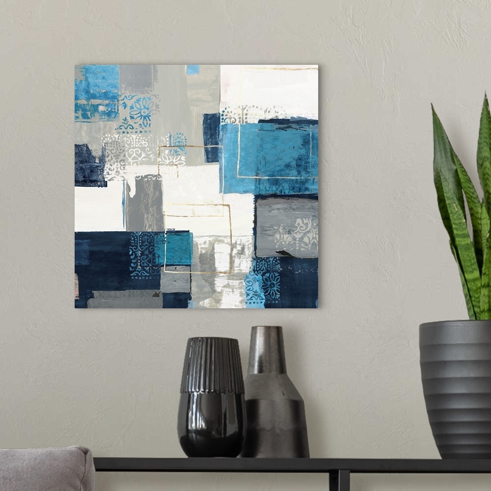 A modern room featuring Bohemian abstract painting in a variety of blue and gray tones with metallic accents.