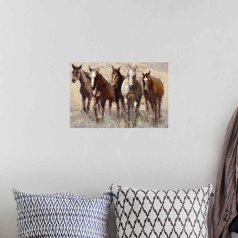 A bohemian room featuring Contemporary painting of a band of brown horses in a field.