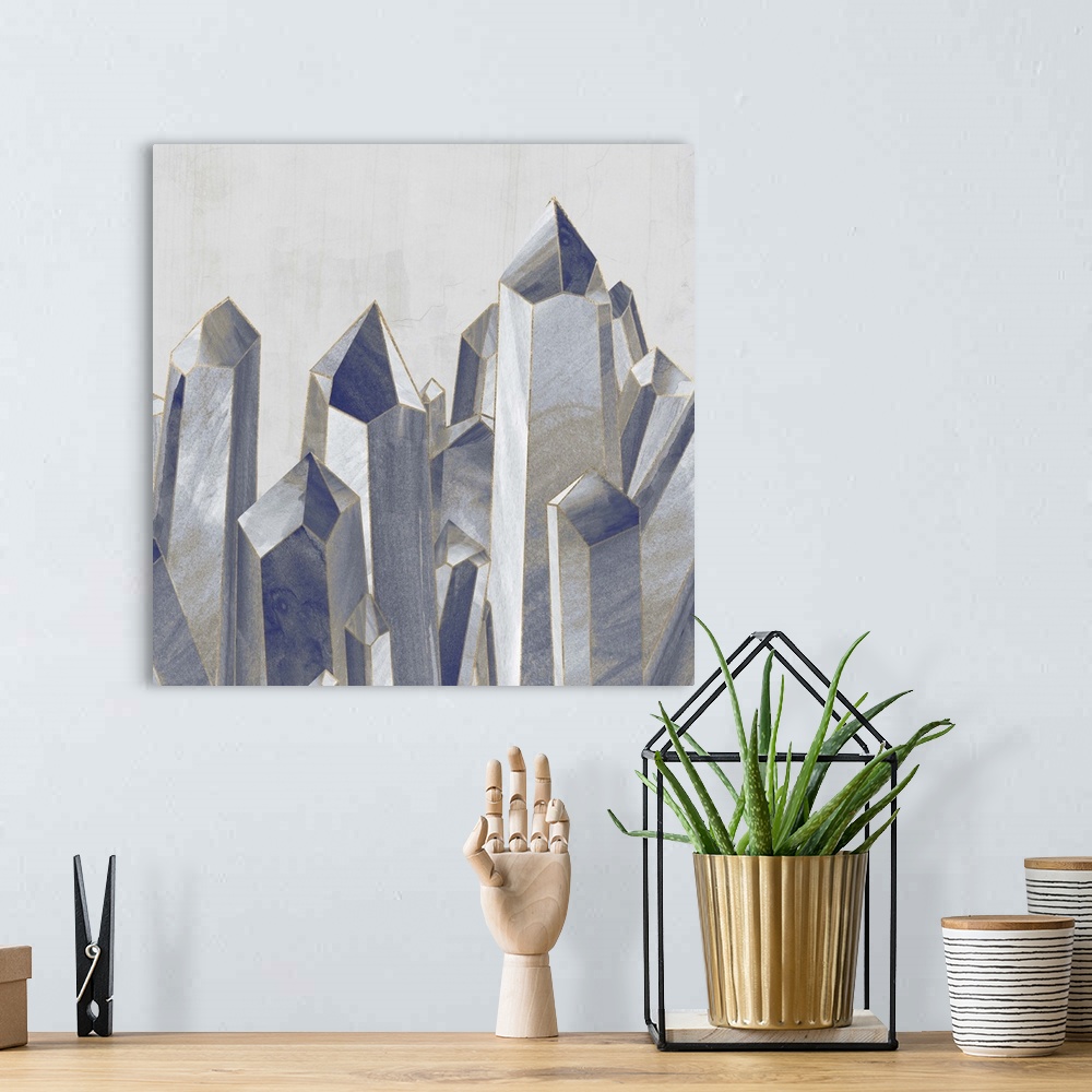 A bohemian room featuring Decorative wall art with long crystal shapes compacted together in shades of blue with metallic g...