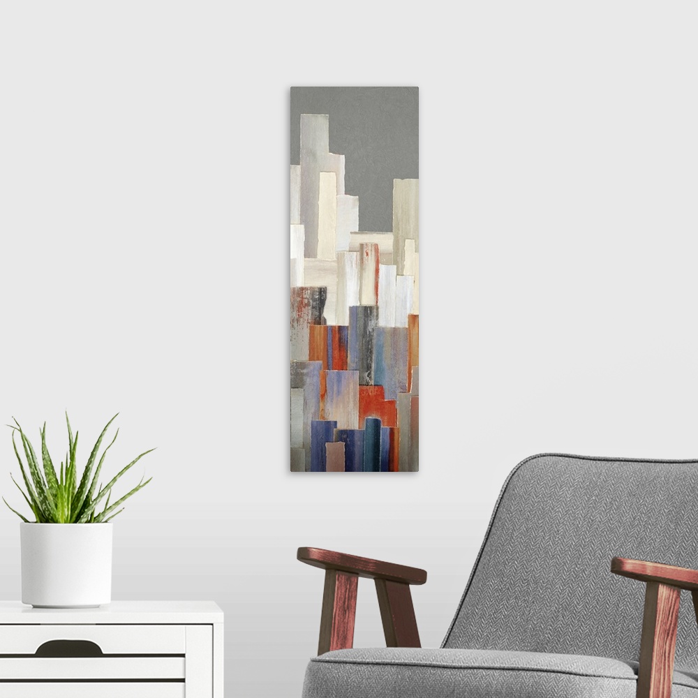 A modern room featuring A long vertical contemporary painting of multi colored buildings in a city.