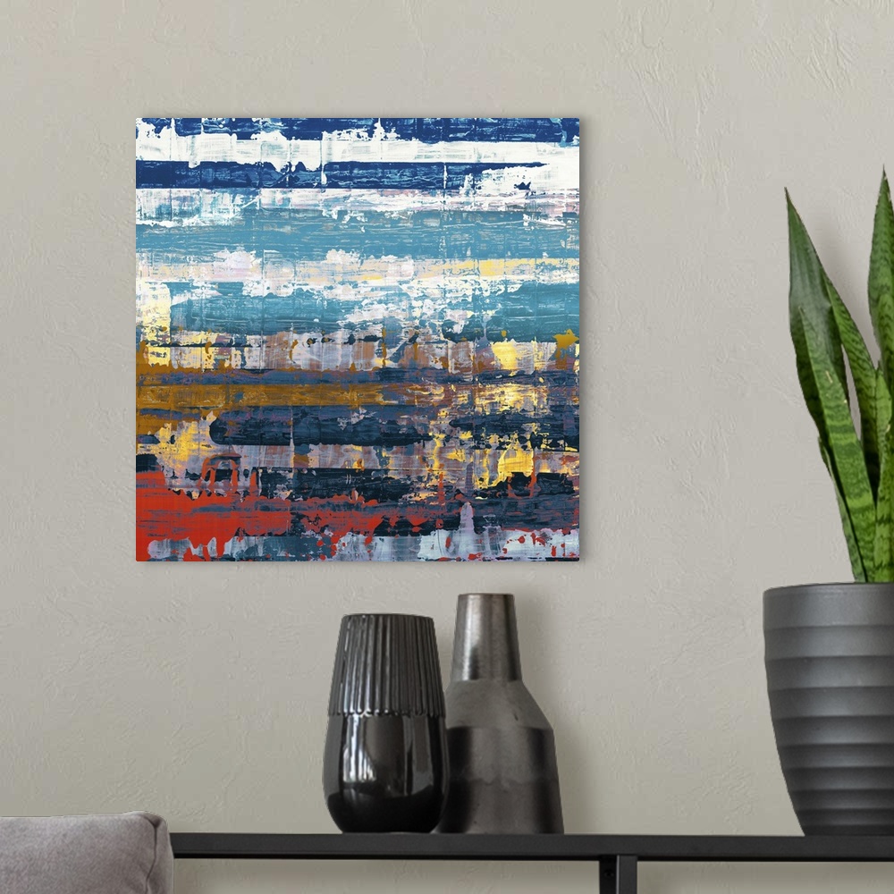 A modern room featuring Contemporary abstract home decor artwork using blues and reds in distressed conditions.