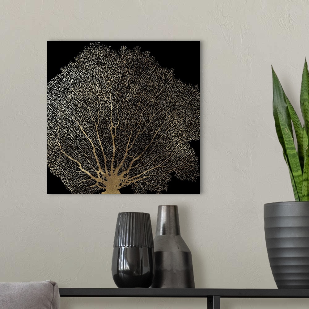 A modern room featuring Contemporary home decor artwork of golden coral against a black background.