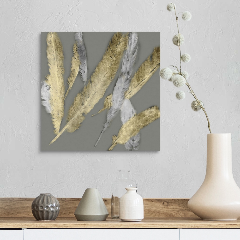 A farmhouse room featuring Contemporary home decor artwork of gold and silver feathers fluttering against a gray background.