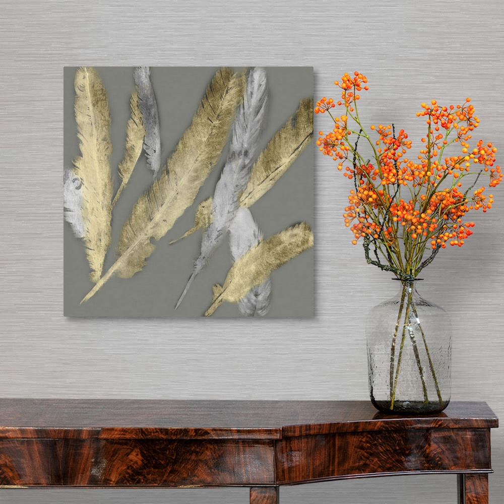 A traditional room featuring Contemporary home decor artwork of gold and silver feathers fluttering against a gray background.