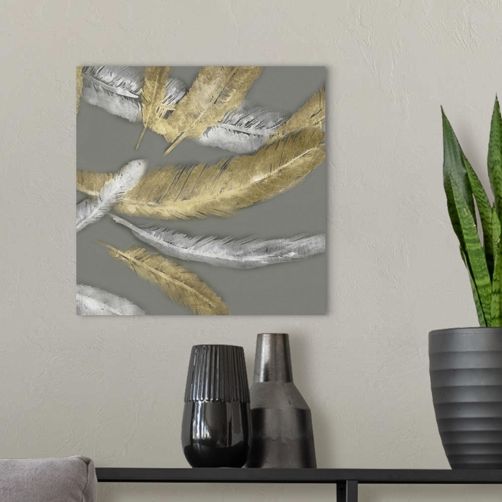 A modern room featuring Contemporary home decor artwork of gold and silver feathers fluttering against a gray background.