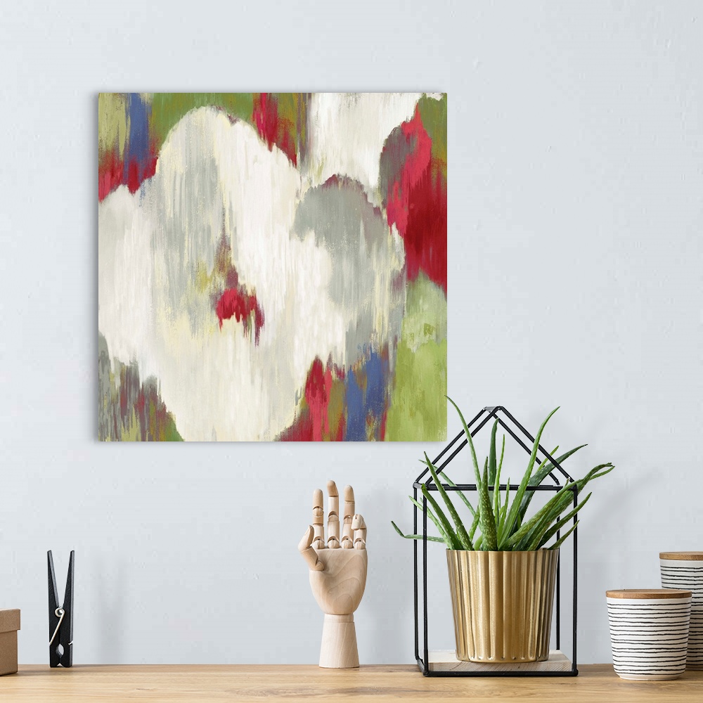 A bohemian room featuring Contemporary home decor artwork of abstracted flowers in different colors.