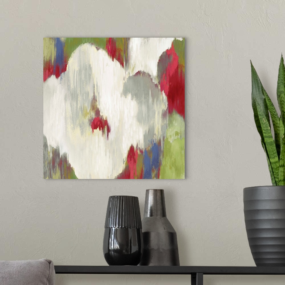 A modern room featuring Contemporary home decor artwork of abstracted flowers in different colors.