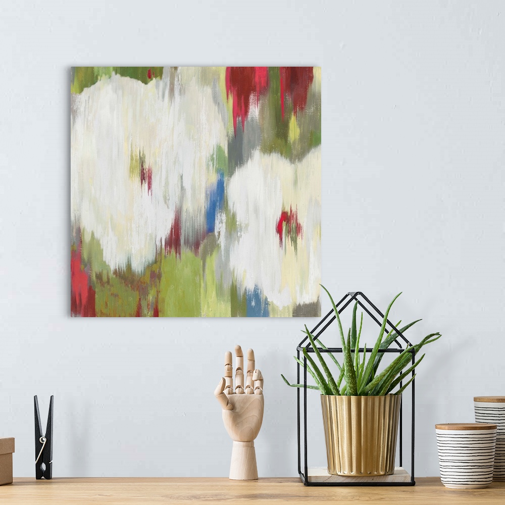A bohemian room featuring Contemporary home decor artwork of abstracted flowers in different colors.