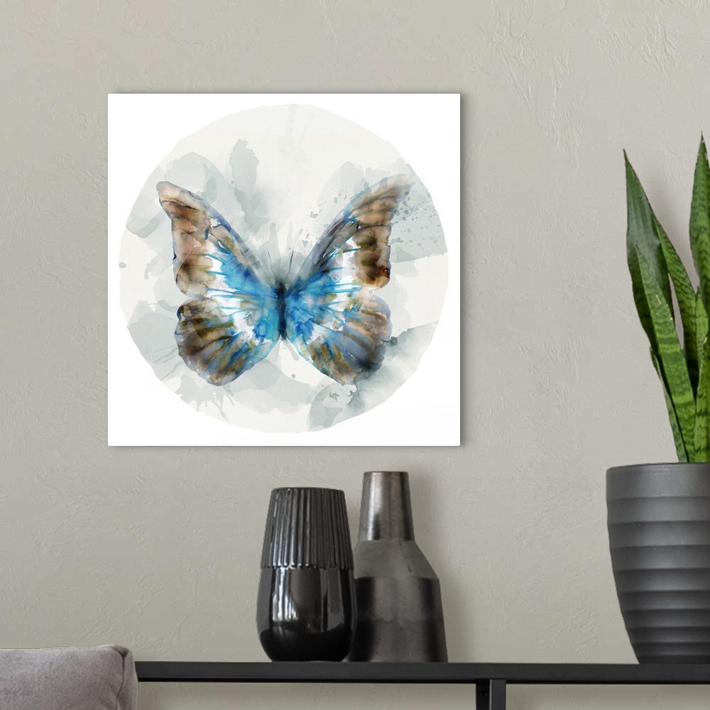 A modern room featuring Watercolor artwork of a butterfly with broad blue and copper colored wings on a grey circular des...