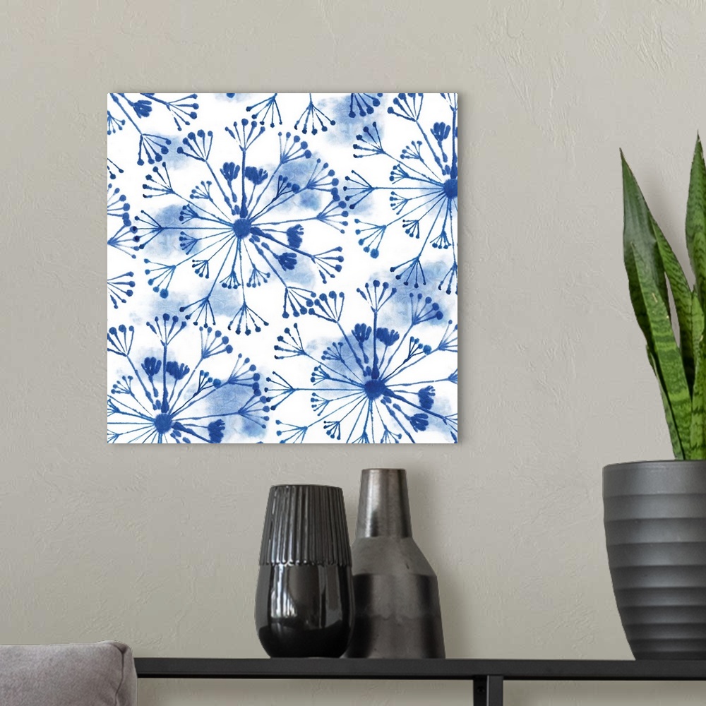 A modern room featuring Watercolor artwork of a navy blue Shibori style pattern.