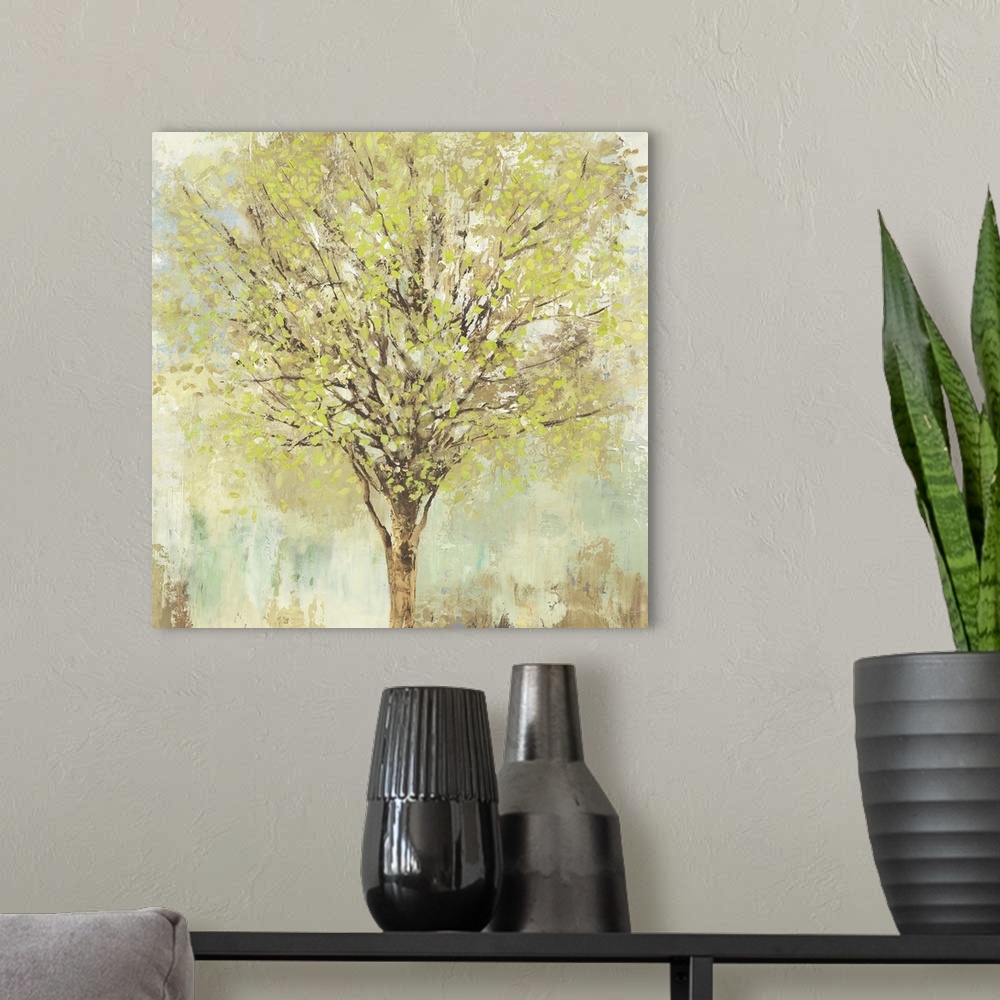 A modern room featuring Contemporary artwork of a tree with leafy branches in pale shades of green, blue, and brown.