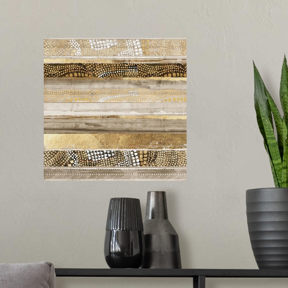 A modern room featuring Abstract painting in horizontal layers in golden shades with dotted patterns.
