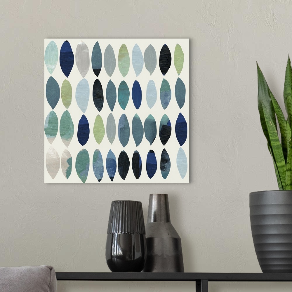 A modern room featuring Abstract painting of leafs in shades of blue and green.