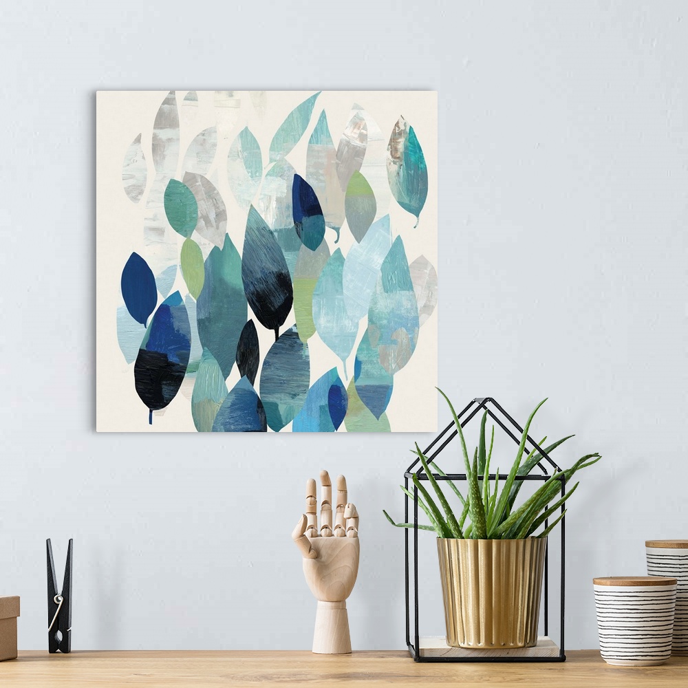 A bohemian room featuring Square abstract painting of leaves in shades of blue.