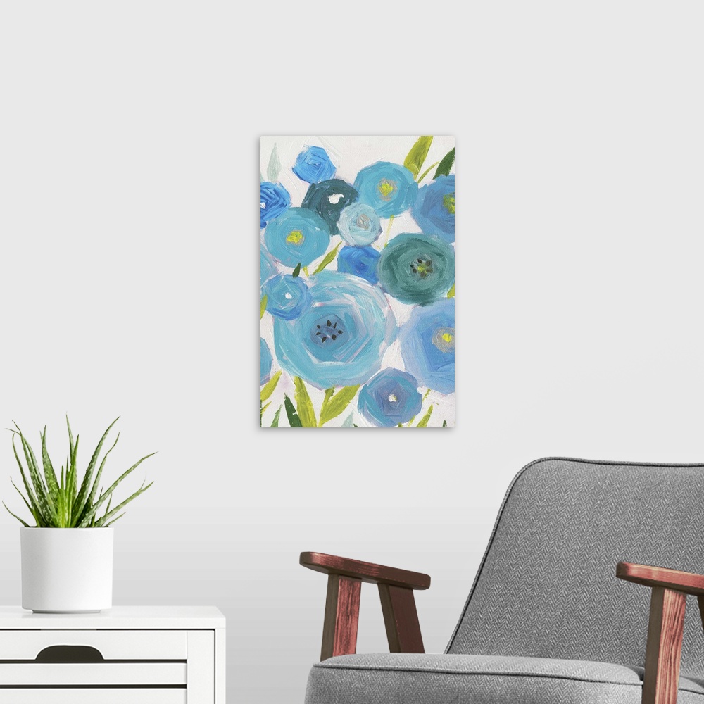 A modern room featuring A vertical painting of different shades of blue poppies against a neutral backdrop.