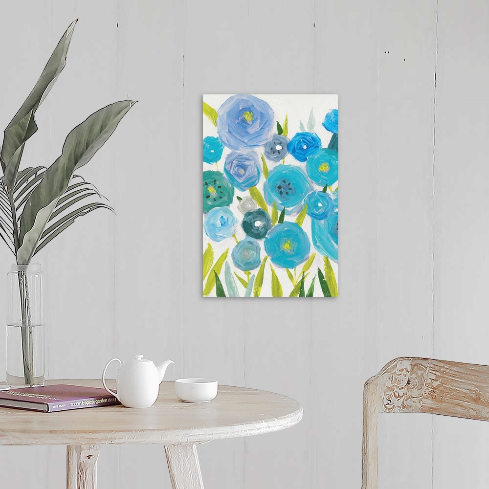 A farmhouse room featuring A vertical painting of different shades of blue poppies against a neutral backdrop.