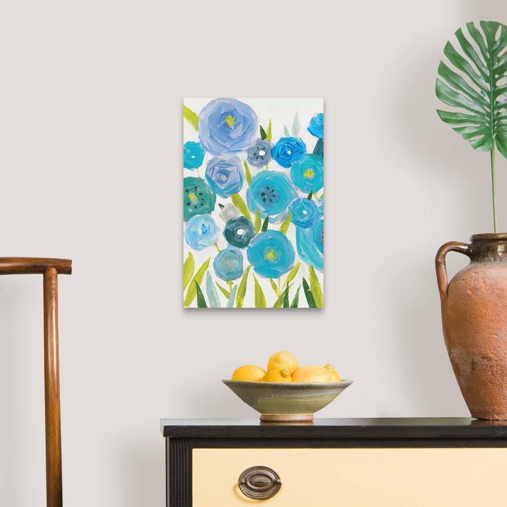 A traditional room featuring A vertical painting of different shades of blue poppies against a neutral backdrop.