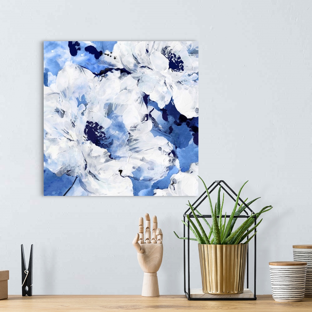 A bohemian room featuring Square contemporary painting of white flowers on a blue background in textured paint.