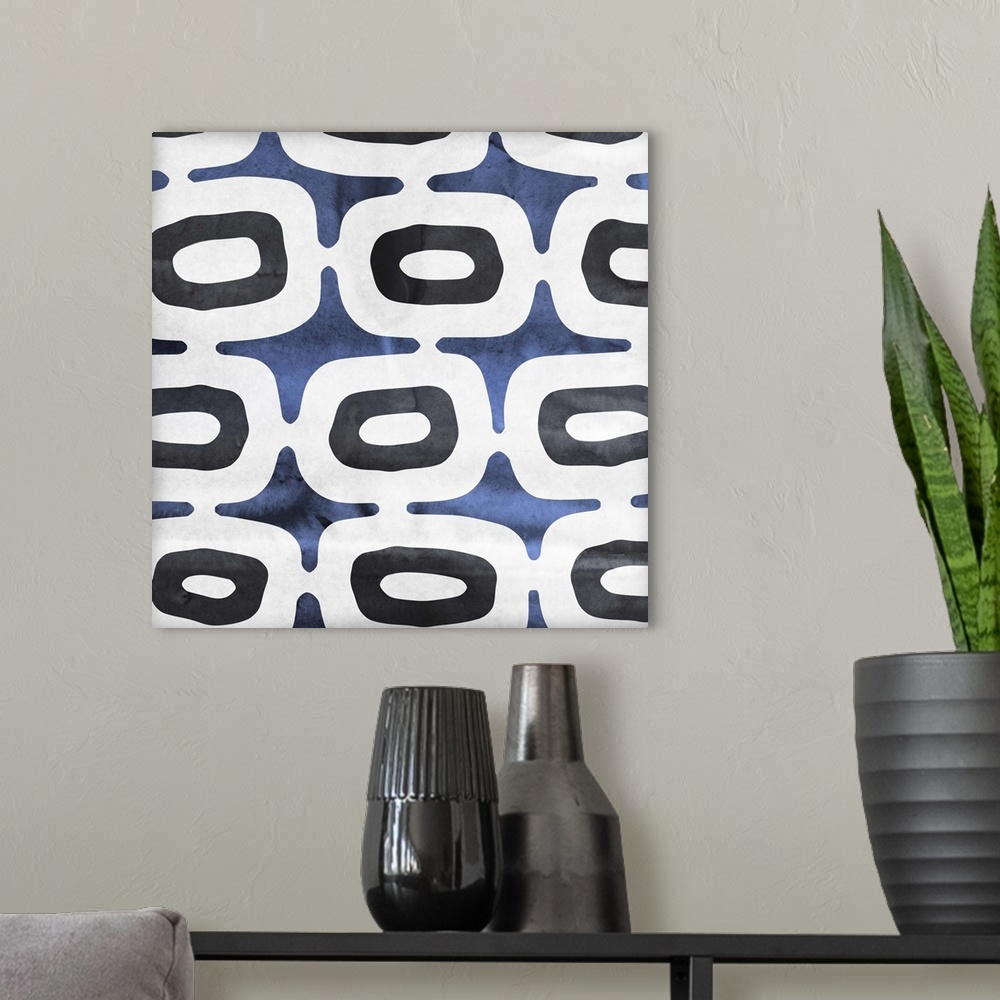 A modern room featuring Contemporary home decor art of a blue and white abstract pattern.
