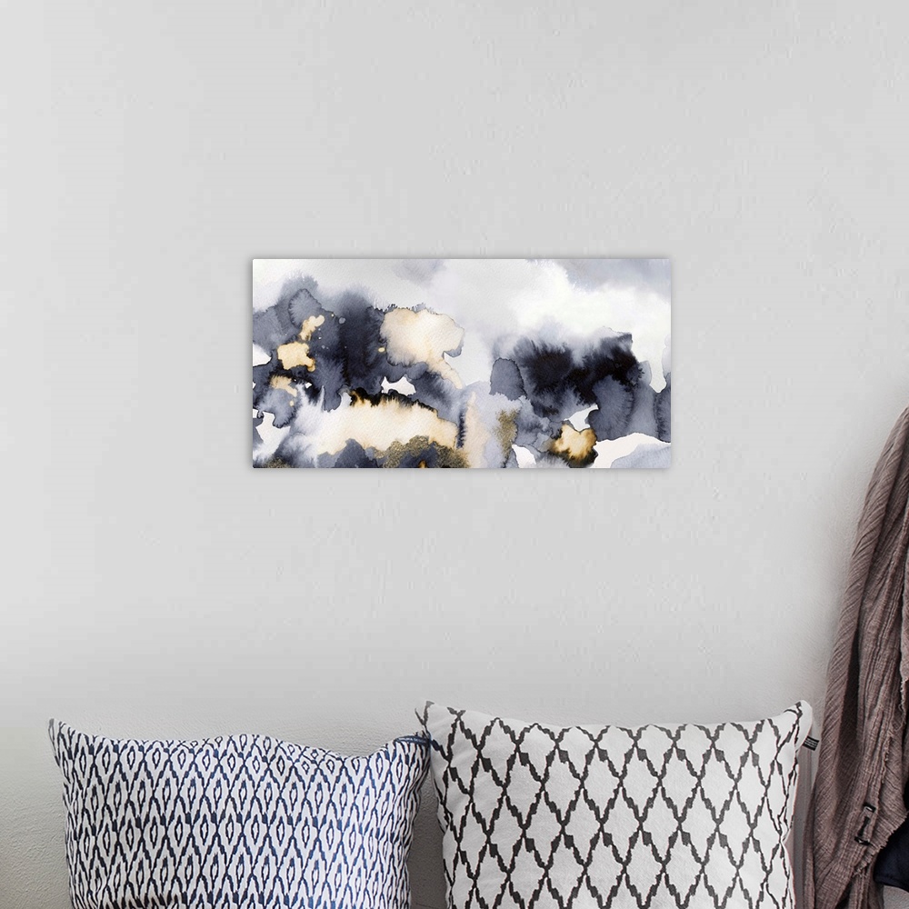 A bohemian room featuring Abstract artwork with different shades of gray and gold.
