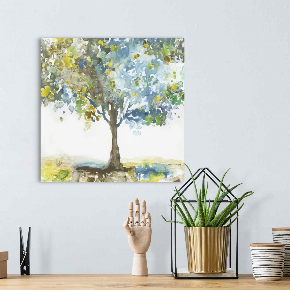A bohemian room featuring Square painting of a tree made with blotched blue, brown, green, and yellow hues on a white backg...