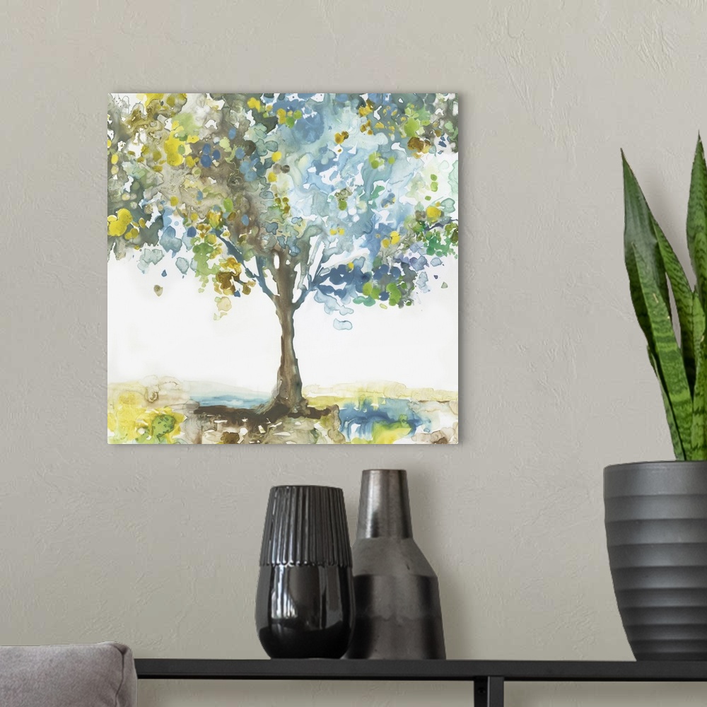 A modern room featuring Square painting of a tree made with blotched blue, brown, green, and yellow hues on a white backg...