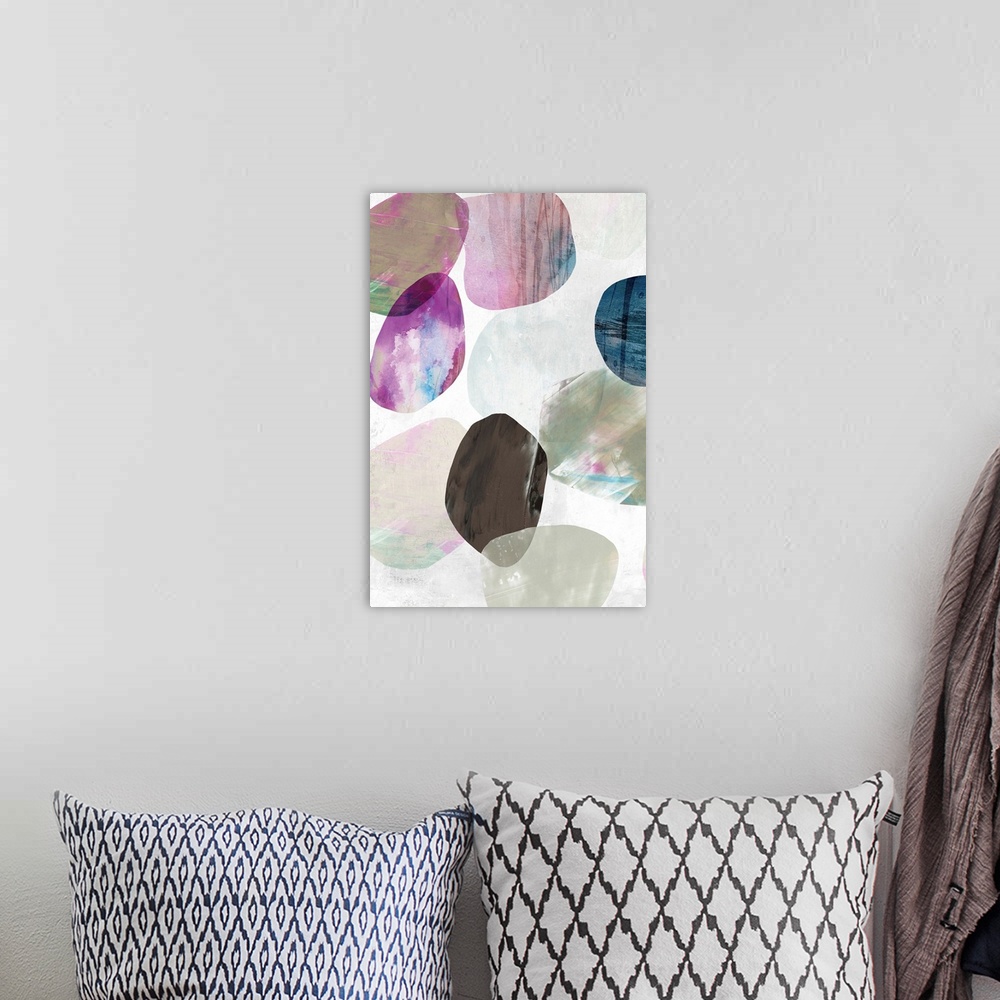 A bohemian room featuring Contemporary painting of multi-color circles in tones of pink, brown and blue in the appearance o...