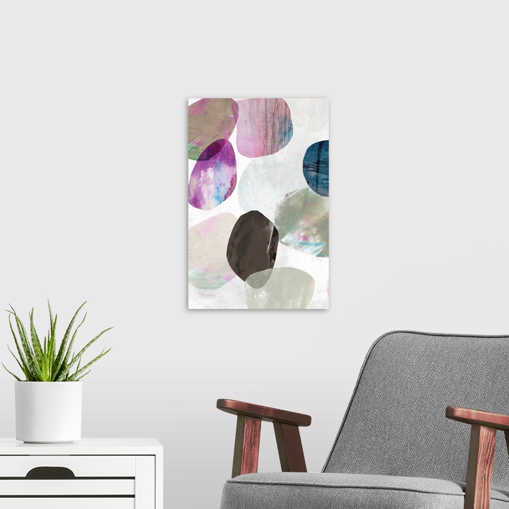 A modern room featuring Contemporary painting of multi-color circles in tones of pink, brown and blue in the appearance o...