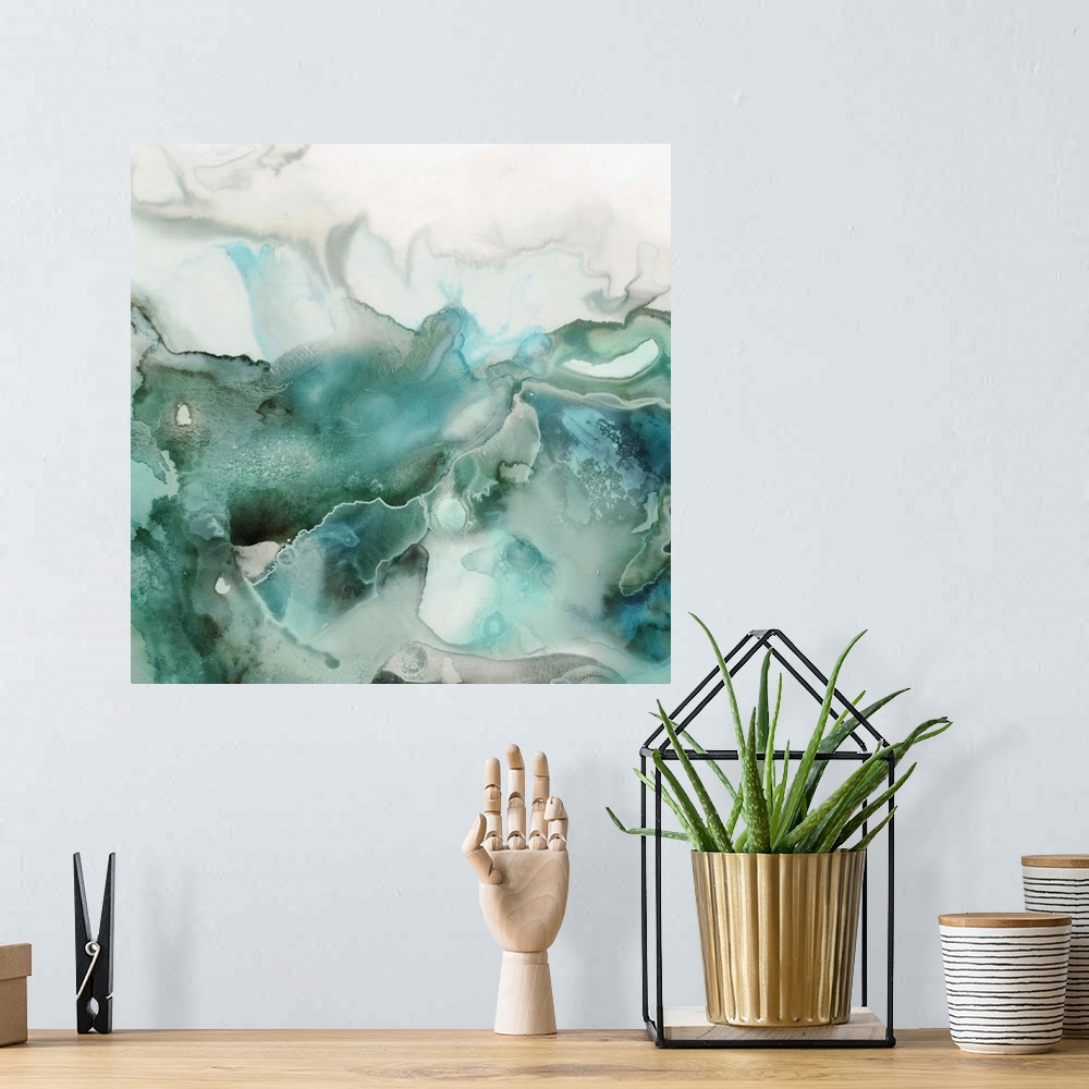 A bohemian room featuring Abstract watercolor artwork of softly blending shades of teal and jade green.