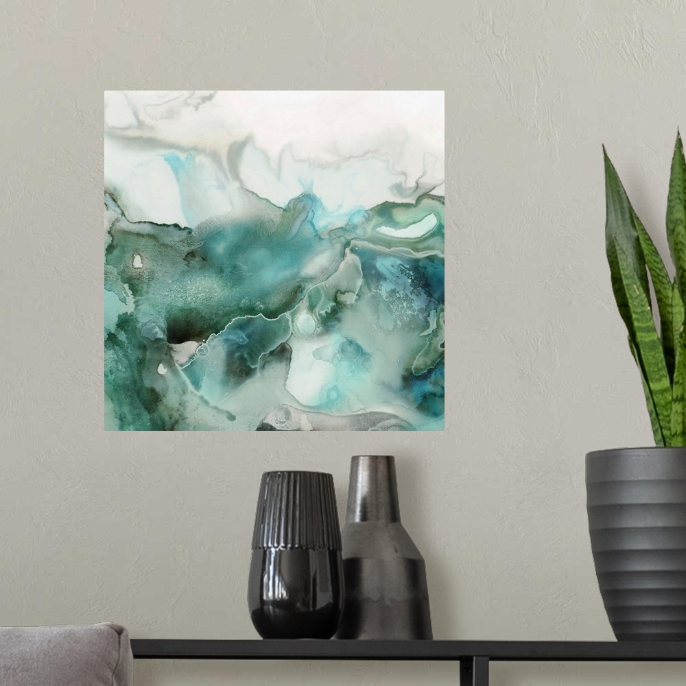 A modern room featuring Abstract watercolor artwork of softly blending shades of teal and jade green.