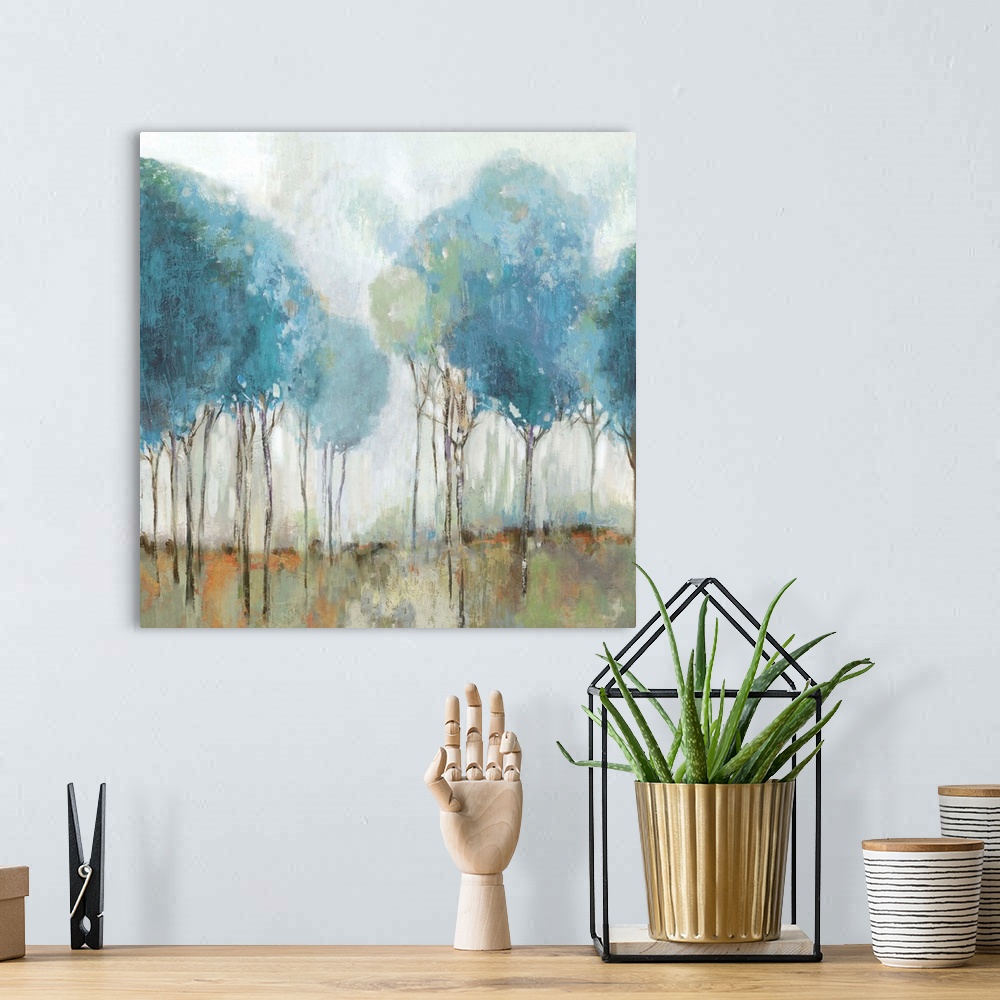 A bohemian room featuring Abstract landscape of a meadow with trees painted in robin's egg blue.