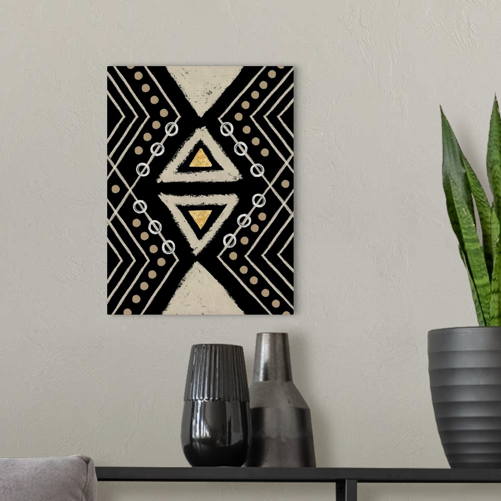 A modern room featuring Vertical abstract artwork with tribal-like designs and geometric shapes in brown, black, and gold...