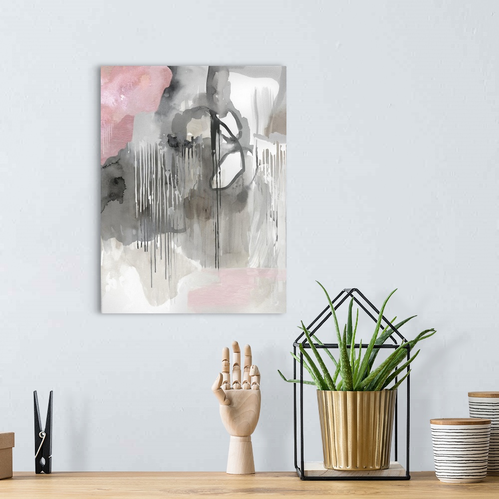 A bohemian room featuring Vertical abstract painting in shades of gray with accents of pink.