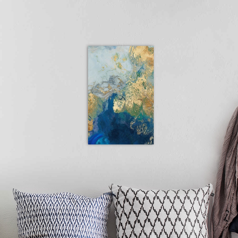 A bohemian room featuring Abstract painting in blue and gold, resembling swirling waves.