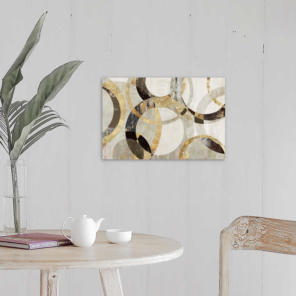 A farmhouse room featuring Geometric abstract artwork with circular rings in shades of brown, gold, and gray.
