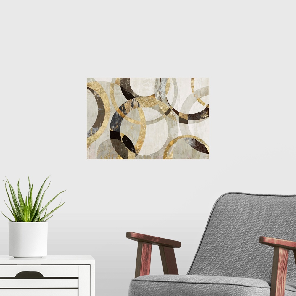 A modern room featuring Geometric abstract artwork with circular rings in shades of brown, gold, and gray.